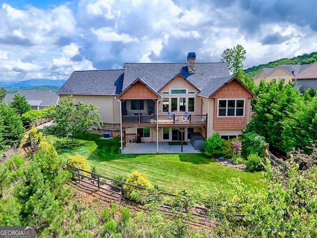 899 Ridge Pointe Way, Blairsville, GA 30512 - back of property featuring a patio area, a deck, roof with shingles, and a chimney