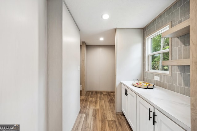 1413 Hephzibah Mcbean Rd, Hephzibah, GA 30815 - bathroom featuring wood finished floors, tasteful backsplash, and recessed lighting
