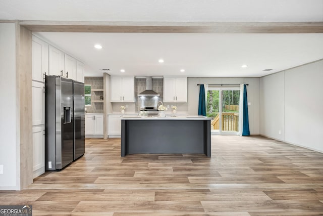 1413 Hephzibah Mcbean Rd, Hephzibah, GA 30815 - kitchen featuring stainless steel appliances, wall chimney exhaust hood, open shelves, white cabinets, and light countertops