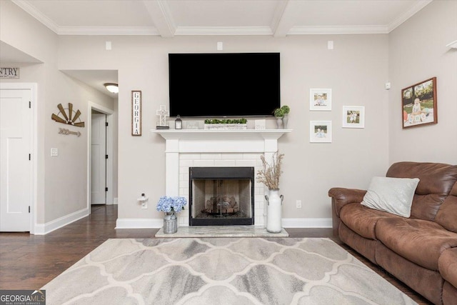 311 Kendall Ct, Perry, GA 31069 - living room featuring wood finished floors, crown molding, a fireplace with raised hearth, and beamed ceiling
