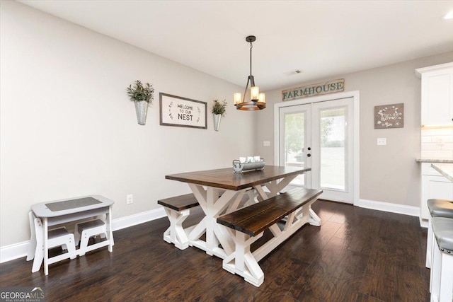 311 Kendall Ct, Perry, GA 31069 - dining area featuring dark wood-style floors, a chandelier, and french doors