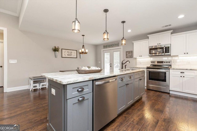 311 Kendall Ct, Perry, GA 31069 - kitchen featuring stainless steel appliances, gray cabinetry, dark wood finished floors, white cabinetry, and recessed lighting