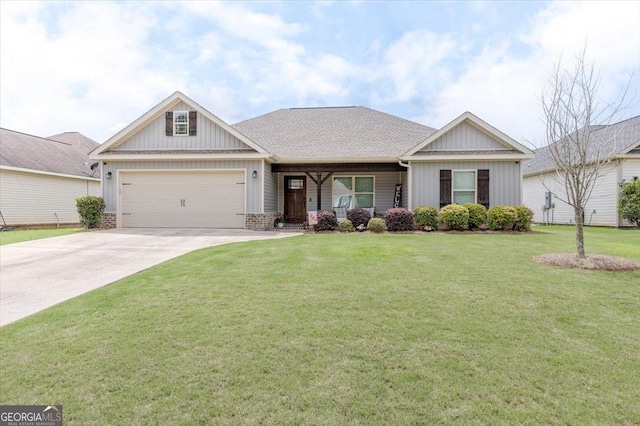 311 Kendall Ct, Perry, GA 31069 - view of front facade featuring a garage, concrete driveway, a front lawn, and brick siding