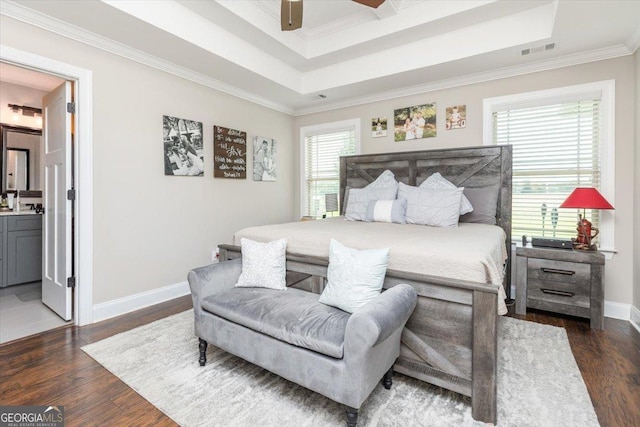 311 Kendall Ct, Perry, GA 31069 - bedroom with wood finished floors, crown molding, ensuite bathroom, and a ceiling fan