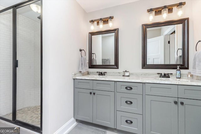 311 Kendall Ct, Perry, GA 31069 - bathroom featuring double vanity and a stall shower