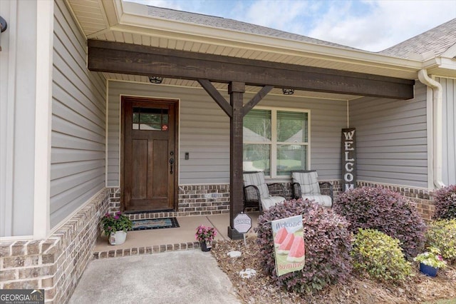 311 Kendall Ct, Perry, GA 31069 - property entrance featuring a porch and stone siding
