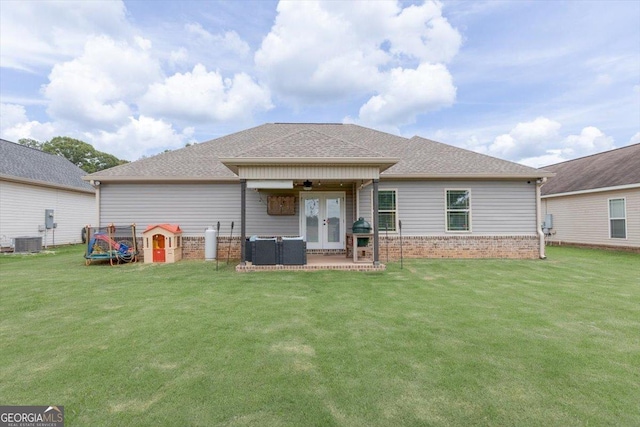 311 Kendall Ct, Perry, GA 31069 - rear view of property featuring french doors, ceiling fan, a lawn, and a patio area