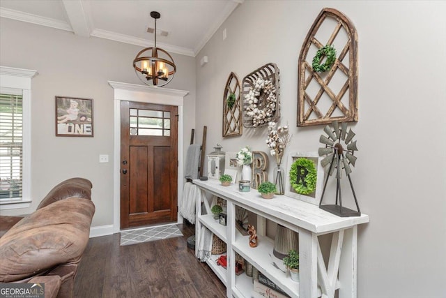 311 Kendall Ct, Perry, GA 31069 - foyer entrance featuring dark wood finished floors, a chandelier, and crown molding