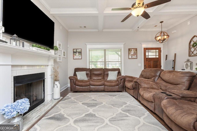 311 Kendall Ct, Perry, GA 31069 - living area featuring coffered ceiling, beamed ceiling, wood finished floors, ceiling fan, and a tiled fireplace