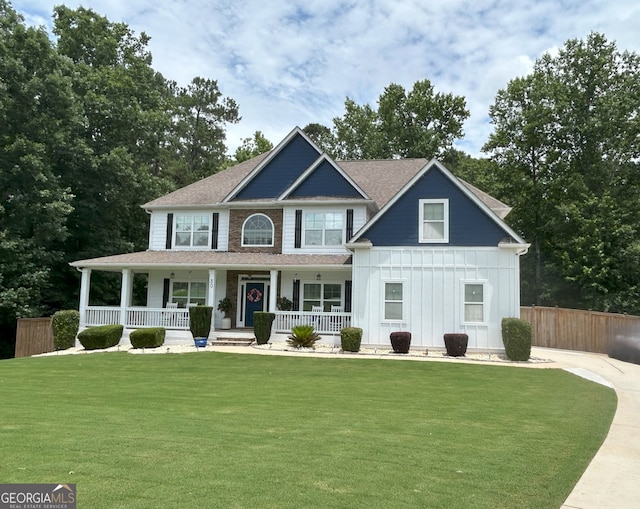 30 Stony Ridge Pt, Newnan, GA 30265 - view of front of property with a porch, board and batten siding, and roof with shingles