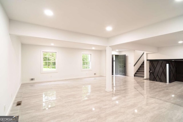 69 N Hearn Rd, Ellenwood, GA 30294 - unfurnished living room with stairs, recessed lighting, and marble tiled floors