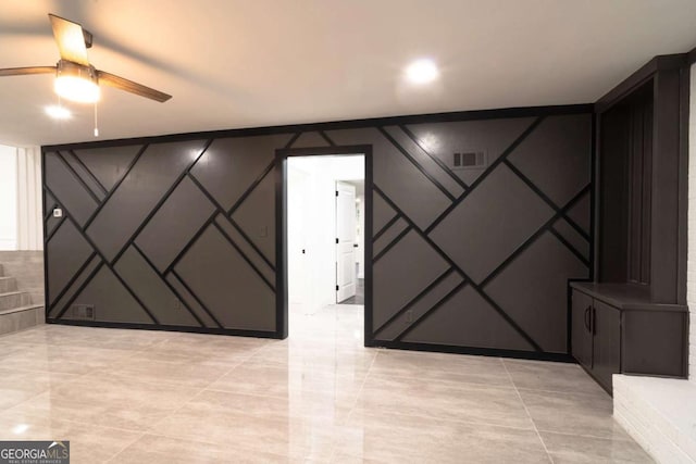 69 N Hearn Rd, Ellenwood, GA 30294 - spare room with a decorative wall, ceiling fan, and light tile patterned flooring