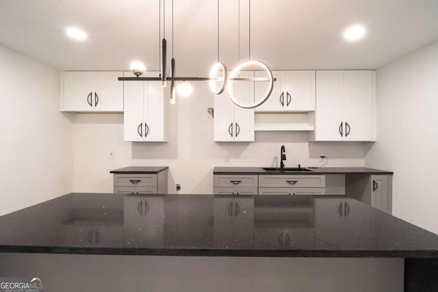 69 N Hearn Rd, Ellenwood, GA 30294 - kitchen featuring white cabinets, recessed lighting, dark stone countertops, and open shelves