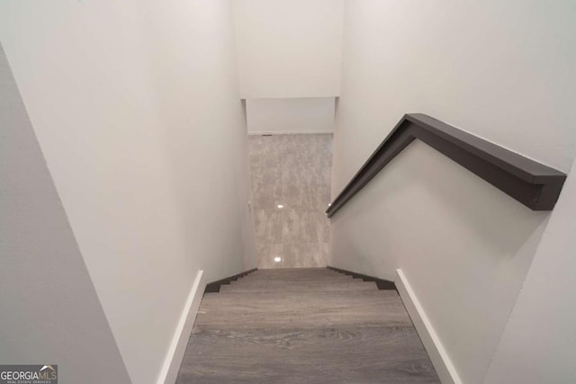 69 N Hearn Rd, Ellenwood, GA 30294 - stairs with wood finished floors and baseboards