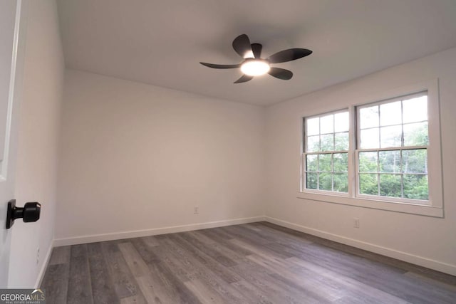 69 N Hearn Rd, Ellenwood, GA 30294 - unfurnished room featuring a ceiling fan and dark wood-type flooring