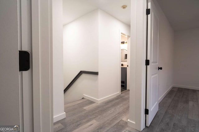 69 N Hearn Rd, Ellenwood, GA 30294 - corridor featuring an upstairs landing and wood finished floors