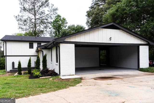 69 N Hearn Rd, Ellenwood, GA 30294 - view of front of home with brick siding, concrete driveway, and a front lawn