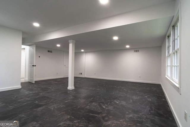 69 N Hearn Rd, Ellenwood, GA 30294 - below grade area featuring marble look tile flooring and recessed lighting
