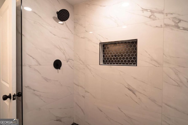 69 N Hearn Rd, Ellenwood, GA 30294 - bathroom featuring a tile shower