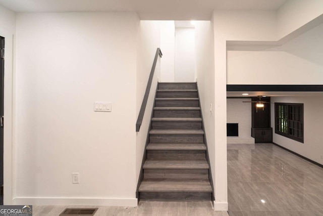 69 N Hearn Rd, Ellenwood, GA 30294 - stairs featuring ceiling fan and baseboards