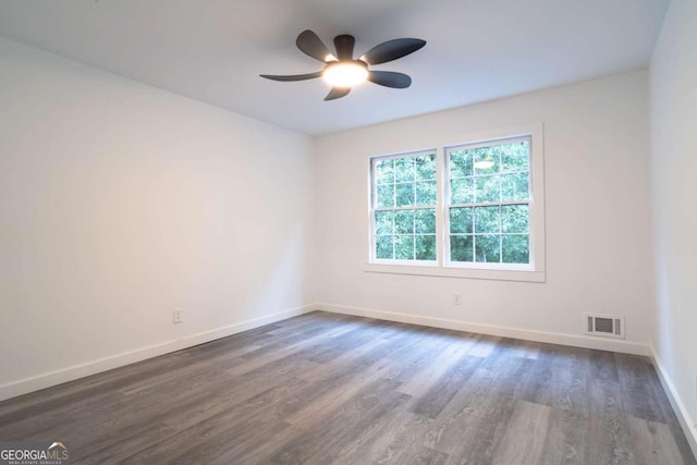 69 N Hearn Rd, Ellenwood, GA 30294 - unfurnished room with ceiling fan and dark wood-type flooring