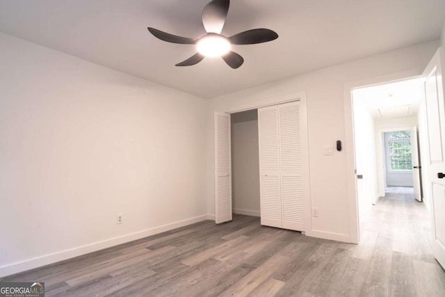 69 N Hearn Rd, Ellenwood, GA 30294 - unfurnished bedroom with wood finished floors, a closet, and ceiling fan