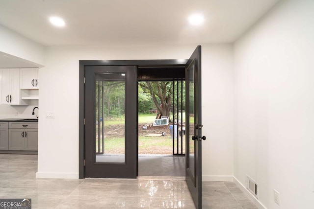 69 N Hearn Rd, Ellenwood, GA 30294 - doorway with healthy amount of natural light, french doors, and recessed lighting