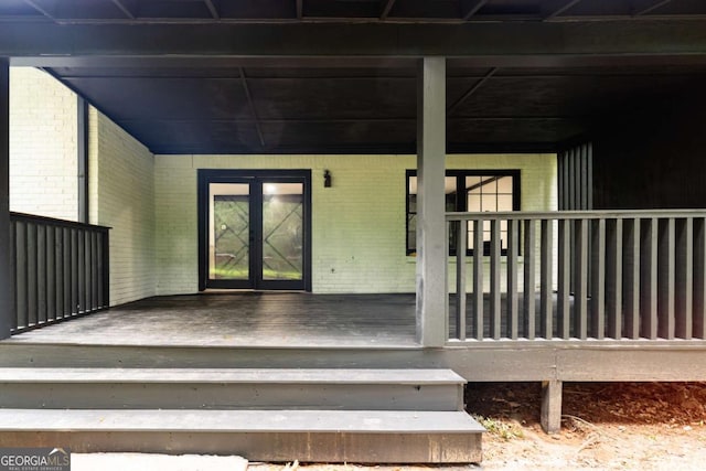 69 N Hearn Rd, Ellenwood, GA 30294 - view of exterior entry featuring brick siding, french doors, and covered porch
