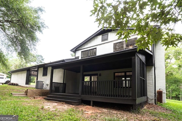69 N Hearn Rd, Ellenwood, GA 30294 - back of house with brick siding and a porch