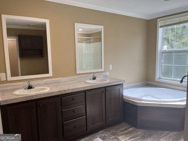 175 Bob White St, Jesup, GA 31545 - full bath featuring double vanity, a garden tub, crown molding, wood finished floors, and a shower