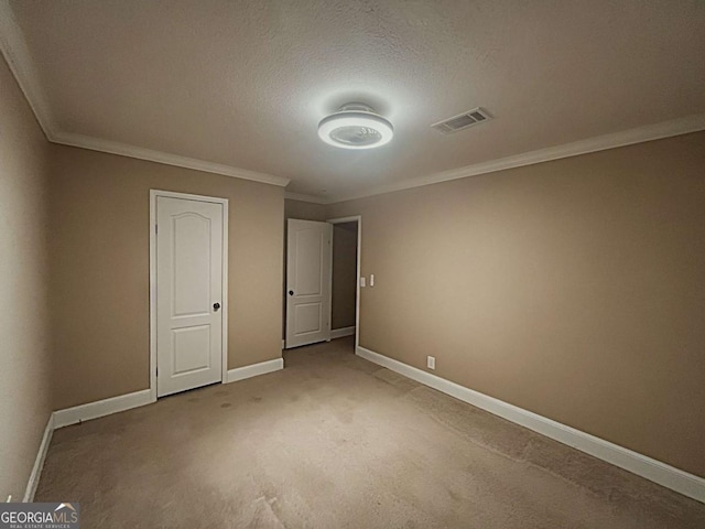 175 Bob White St, Jesup, GA 31545 - unfurnished bedroom featuring ornamental molding, light carpet, and a textured ceiling