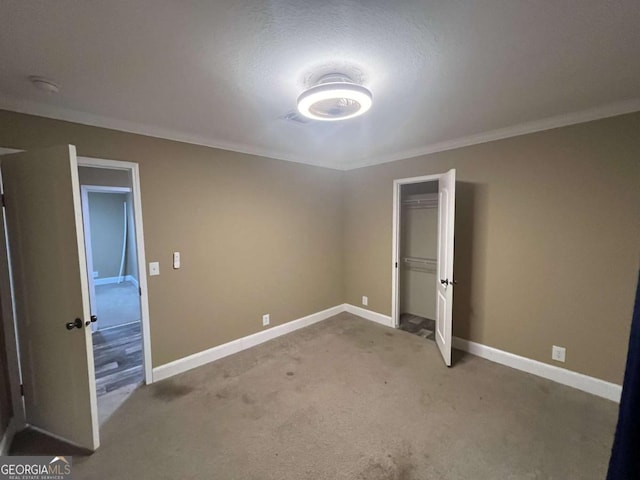 175 Bob White St, Jesup, GA 31545 - unfurnished bedroom featuring light carpet, a closet, and ornamental molding