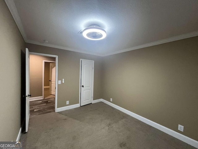 175 Bob White St, Jesup, GA 31545 - unfurnished room with ornamental molding and dark carpet