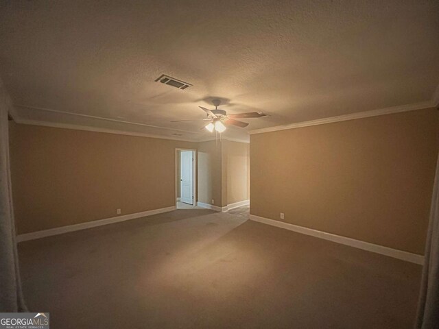 175 Bob White St, Jesup, GA 31545 - carpeted spare room with crown molding, ceiling fan, and a textured ceiling