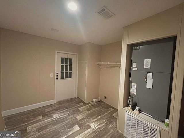 175 Bob White St, Jesup, GA 31545 - laundry room featuring wood finished floors and heating unit
