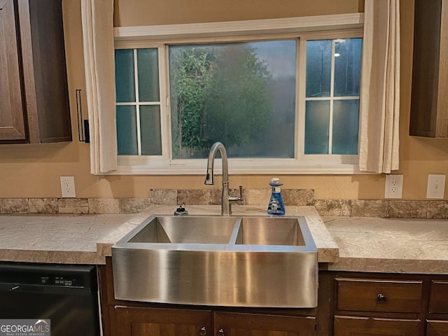 175 Bob White St, Jesup, GA 31545 - kitchen with black dishwasher, dark brown cabinetry, and light countertops