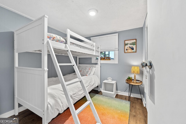 321 Barbara Point Rd, Sparta, GA 31087 - bedroom with wood finished floors and a textured ceiling