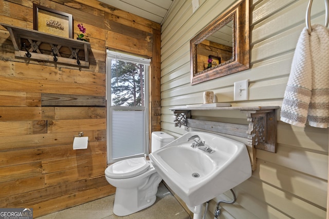 321 Barbara Point Rd, Sparta, GA 31087 - half bathroom featuring wood walls and toilet