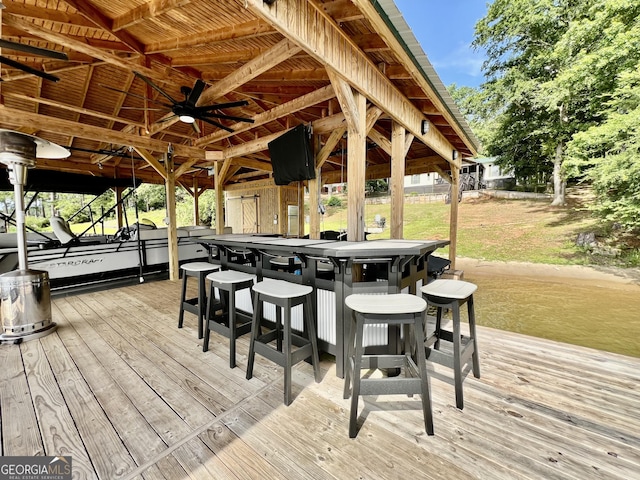 321 Barbara Point Rd, Sparta, GA 31087 - wooden terrace with a dock, a ceiling fan, and boat lift