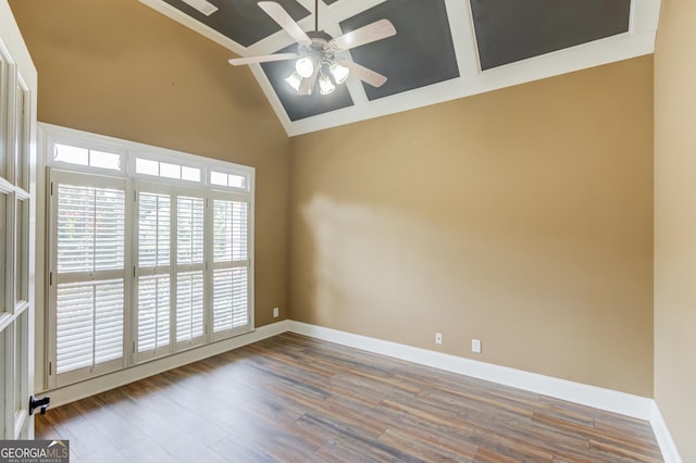3217 Aberrone Pl, Buford, GA 30519 - empty room featuring a ceiling fan, wood finished floors, high vaulted ceiling, and crown molding