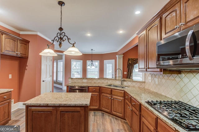 3217 Aberrone Pl, Buford, GA 30519 - kitchen featuring stainless steel appliances, light wood finished floors, a chandelier, light stone countertops, and recessed lighting