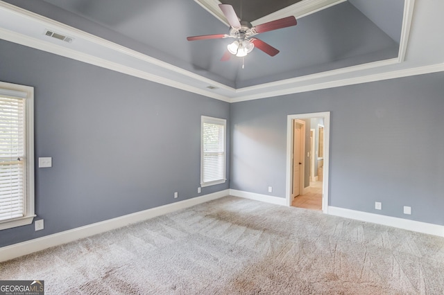 3217 Aberrone Pl, Buford, GA 30519 - spare room featuring a tray ceiling, ceiling fan, carpet flooring, and ornamental molding