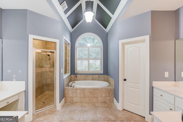 3217 Aberrone Pl, Buford, GA 30519 - full bathroom featuring a shower stall, a bath, vanity, vaulted ceiling, and tile patterned flooring