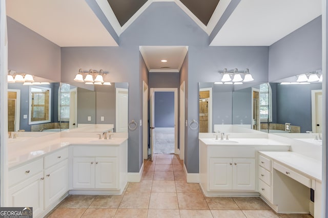 3217 Aberrone Pl, Buford, GA 30519 - full bathroom featuring tile patterned floors, a stall shower, two vanities, and vaulted ceiling