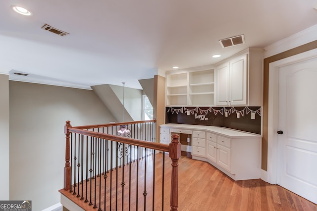 3217 Aberrone Pl, Buford, GA 30519 - corridor with light wood-style flooring, recessed lighting, a desk, and ornamental molding