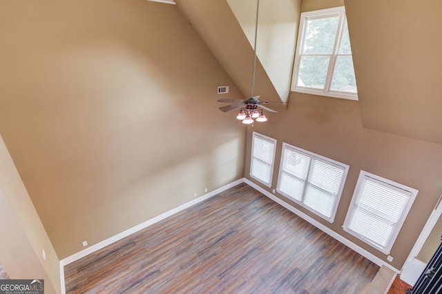 3217 Aberrone Pl, Buford, GA 30519 - spare room with wood finished floors, a high ceiling, and ceiling fan
