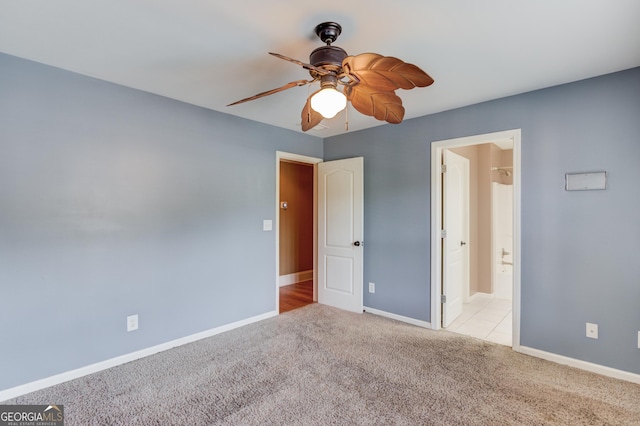 3217 Aberrone Pl, Buford, GA 30519 - unfurnished bedroom with carpet, ceiling fan, and connected bathroom