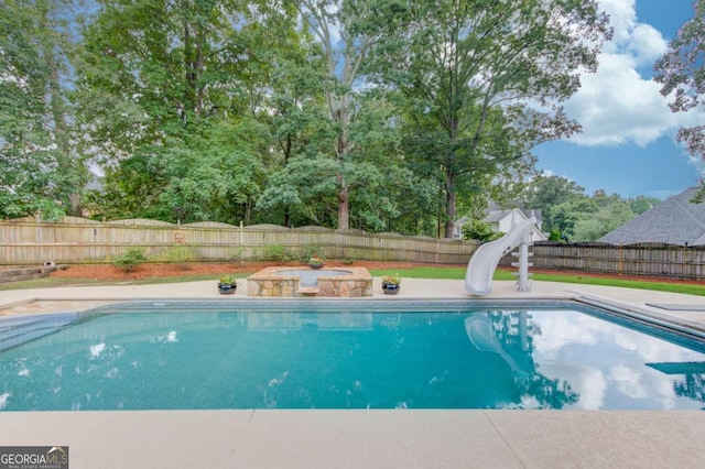 3217 Aberrone Pl, Buford, GA 30519 - view of pool with a water slide and a fenced backyard