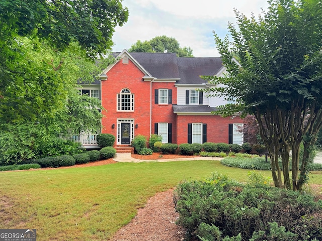 361 Fairway Cir, Monroe, GA 30656 - view of front of house featuring brick siding and a front lawn