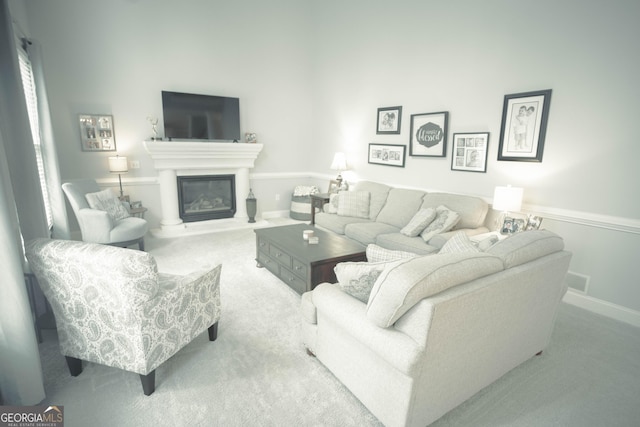 361 Fairway Cir, Monroe, GA 30656 - carpeted living room featuring a glass covered fireplace and baseboards